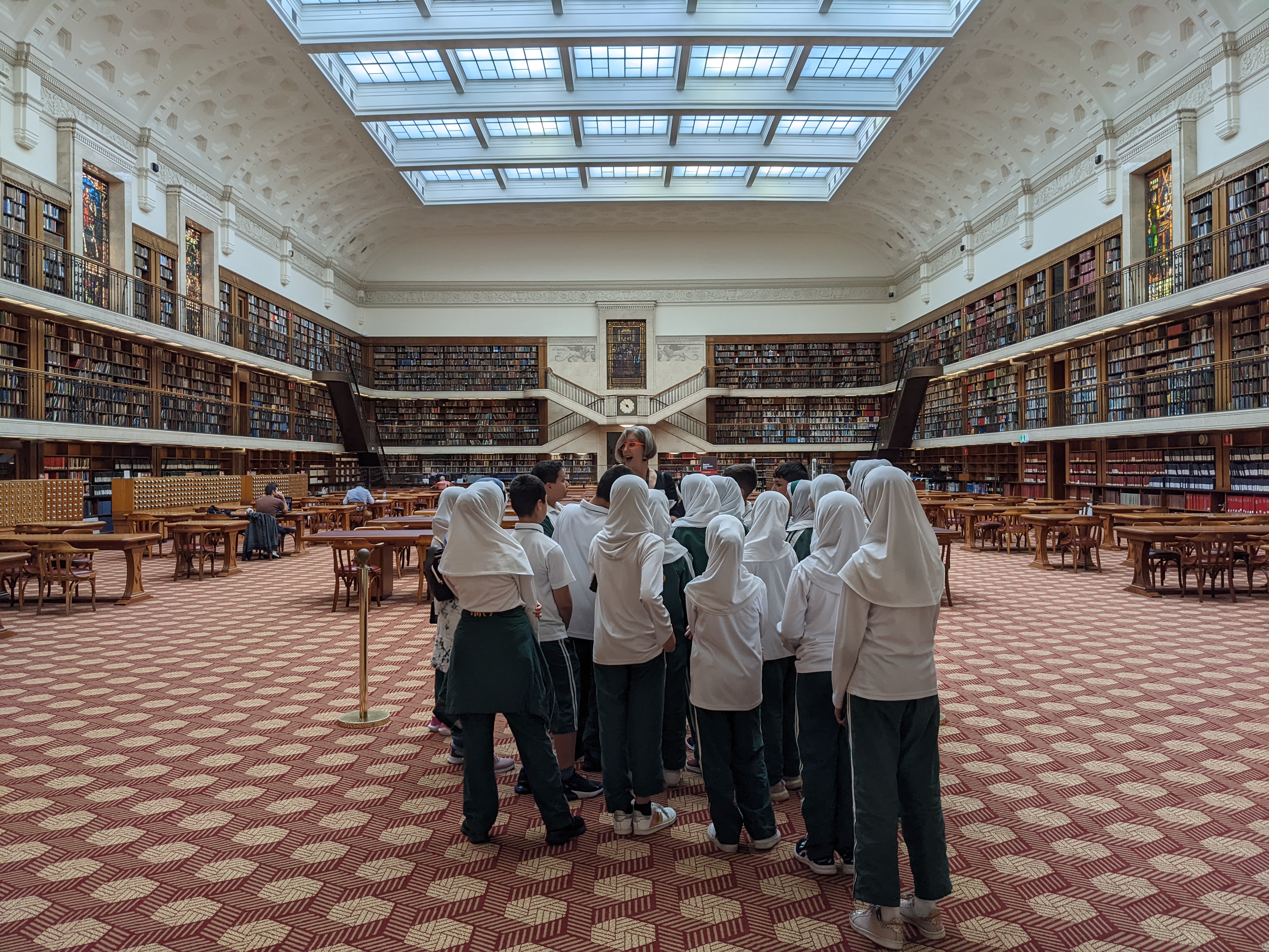 Group of students in the Mitchell Reading Room with a tour guide