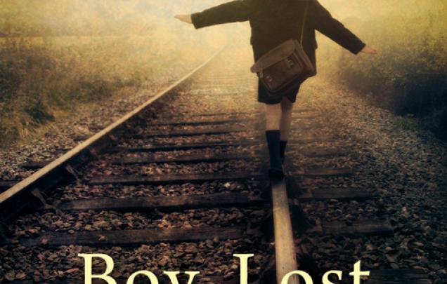 Boy walking along train tracks wearing a school bag on back on book cover of Boy, Lost by Kristina Olsson