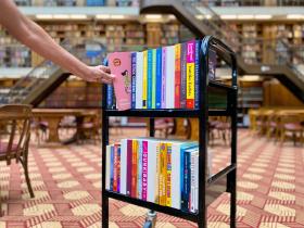 Books on a trolly in the Mitchell Library Reading Room
