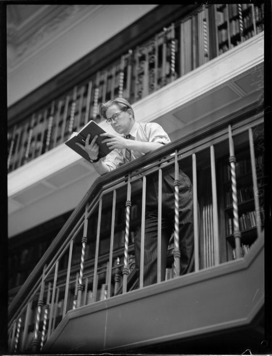 Woman sitting on stairs in Reading Room