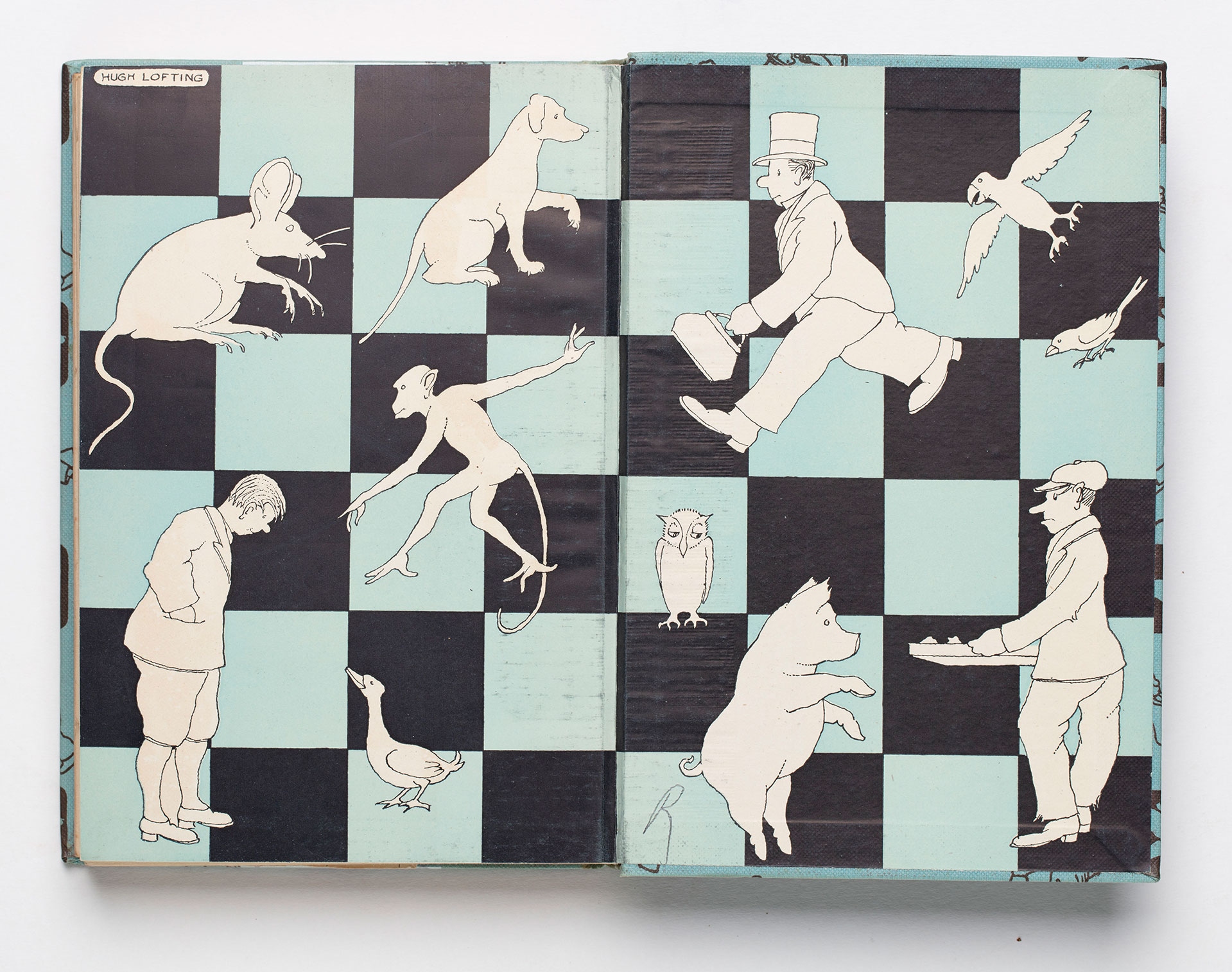 Endpapers illustrating Dr Dolittle on a checquered background.