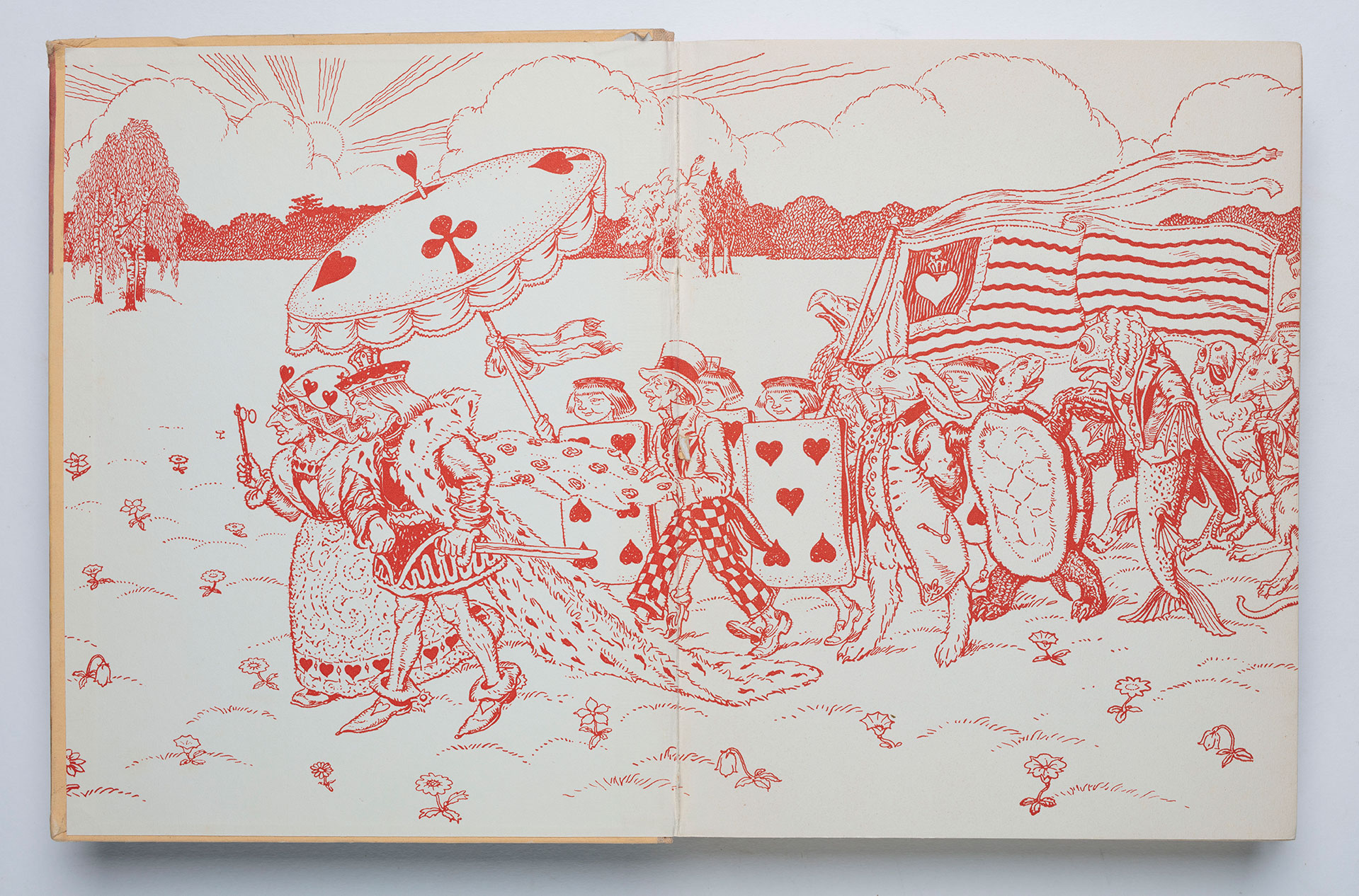 Endpapers illustrating a parade of characters from Alice in Wonderland.