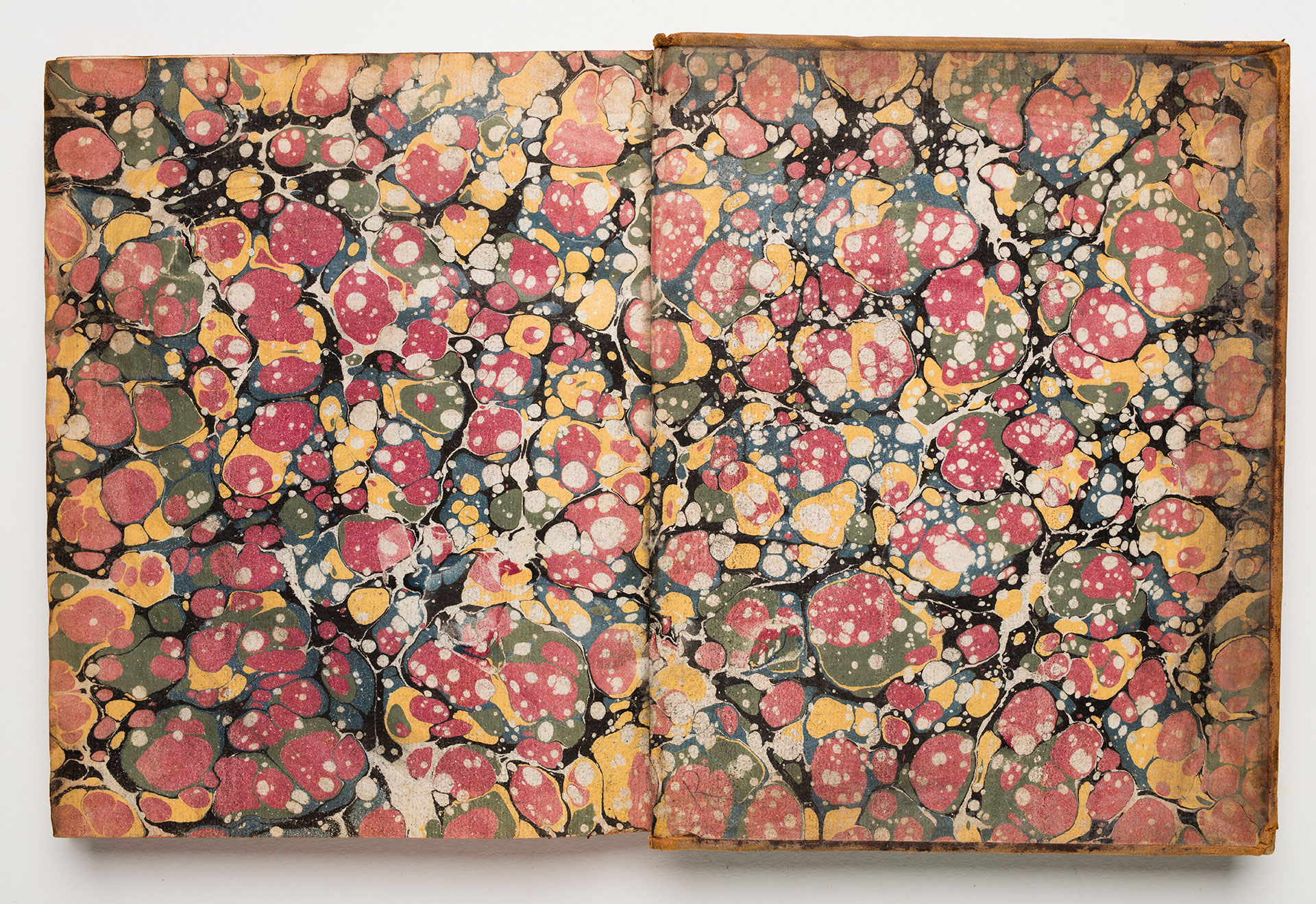 Endpapers with a colourful marbled pattern.