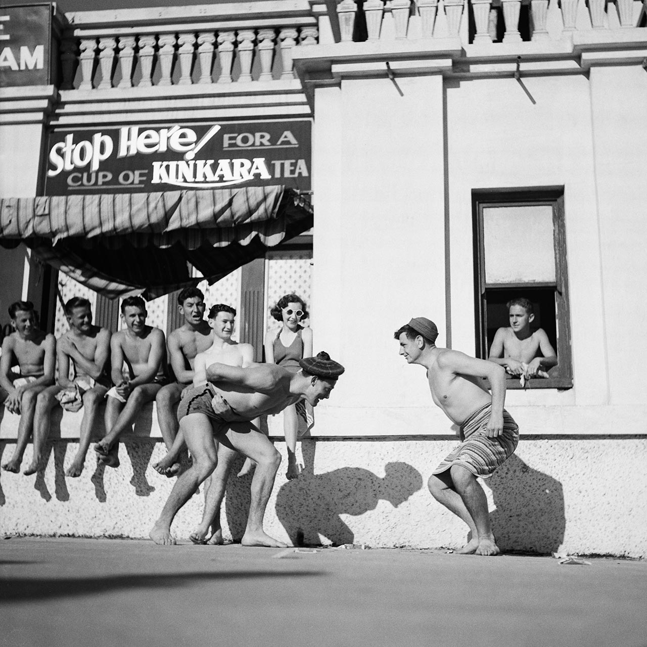 Horsing around outside Tiny's Cafe, North Bondi, 2 October 1939. (Digital ID: a2391030)