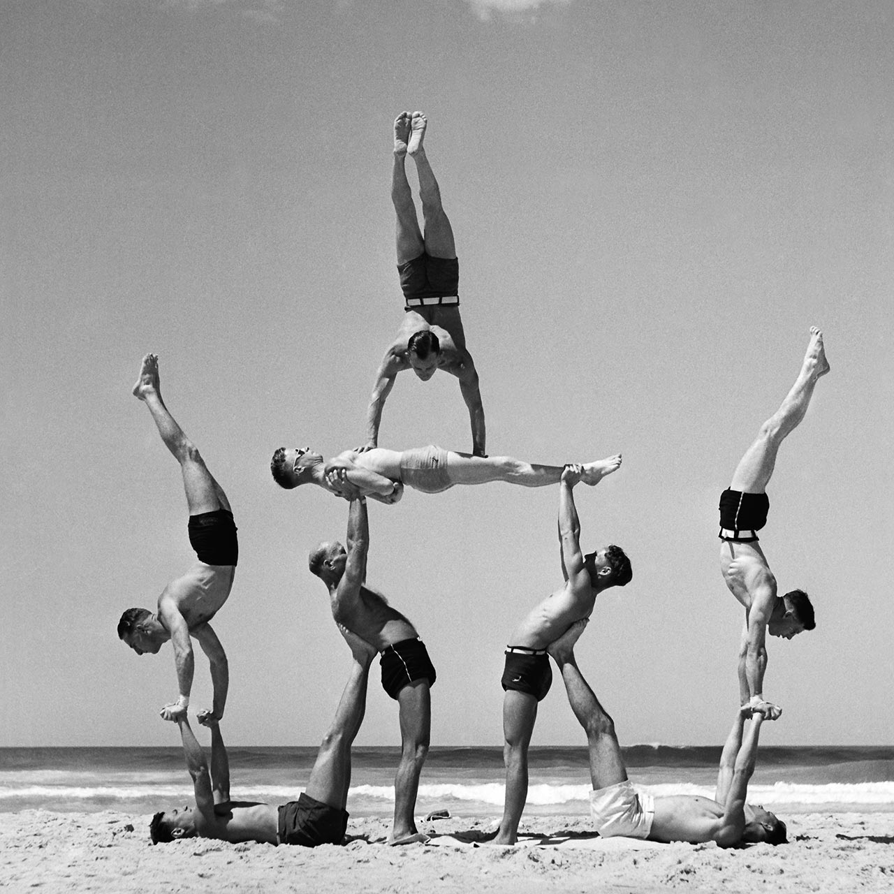Max Stewart handstands atop Frank Cottier, held up by Alf Stanbrough and Vic Whitehead, while Jack Goldberg and Charlie Lusty handstand off Tim Holman and Ken Cumming, 8 October 1939. (Digital ID: a2391032)