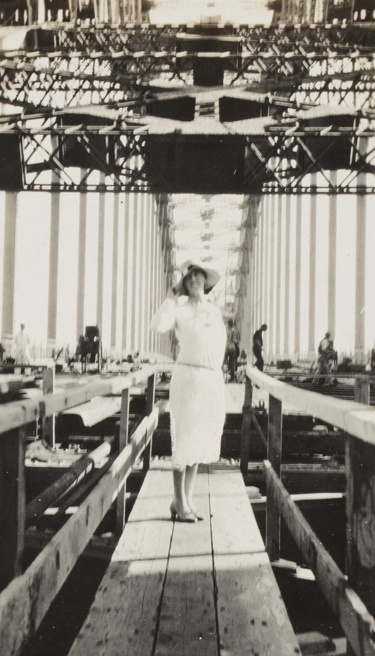 Mrs Smith standing on the transport deck of the Sydney Harbour Bridge, 24 April 1931 