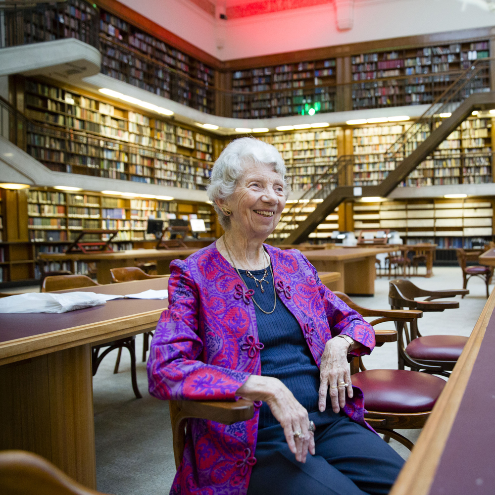 Woman in chair in library