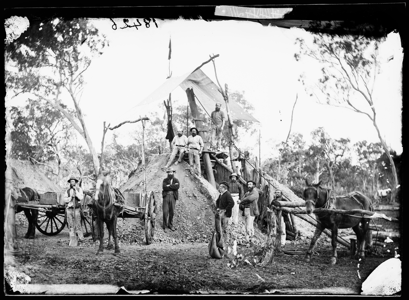 Gold miners on a mine head flying the flag required by law for a gold strike, Home Rule (?)