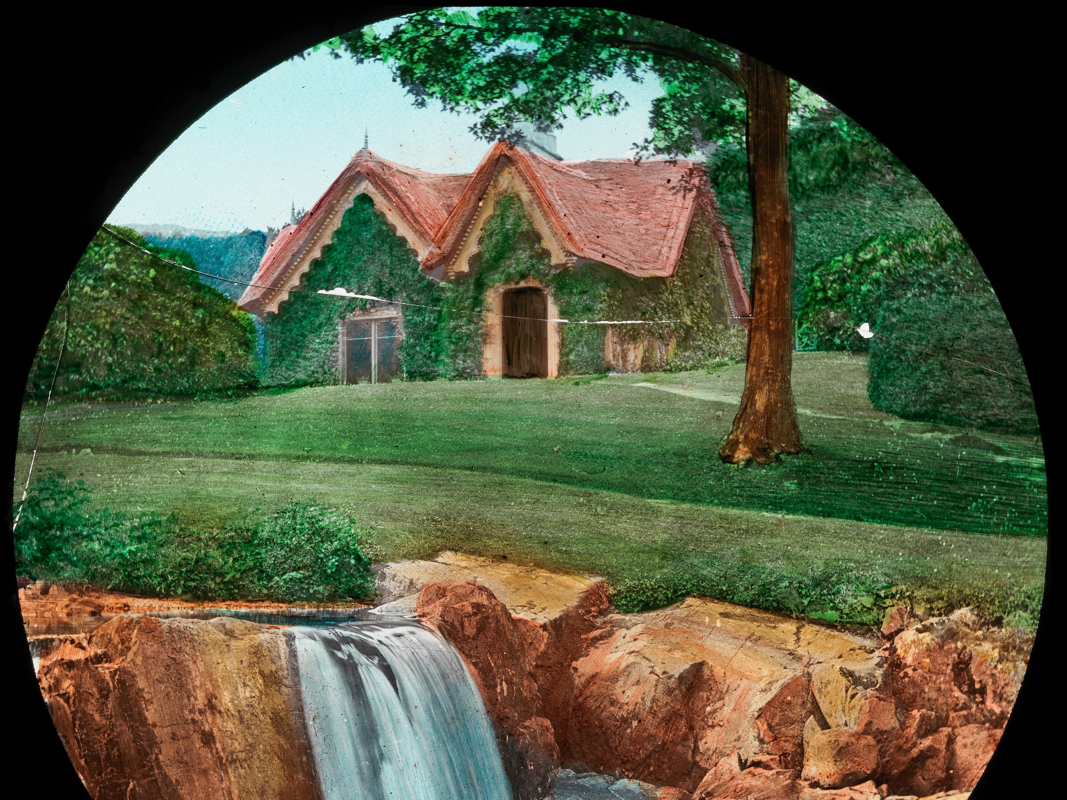 Photograph of cottage and waterfall