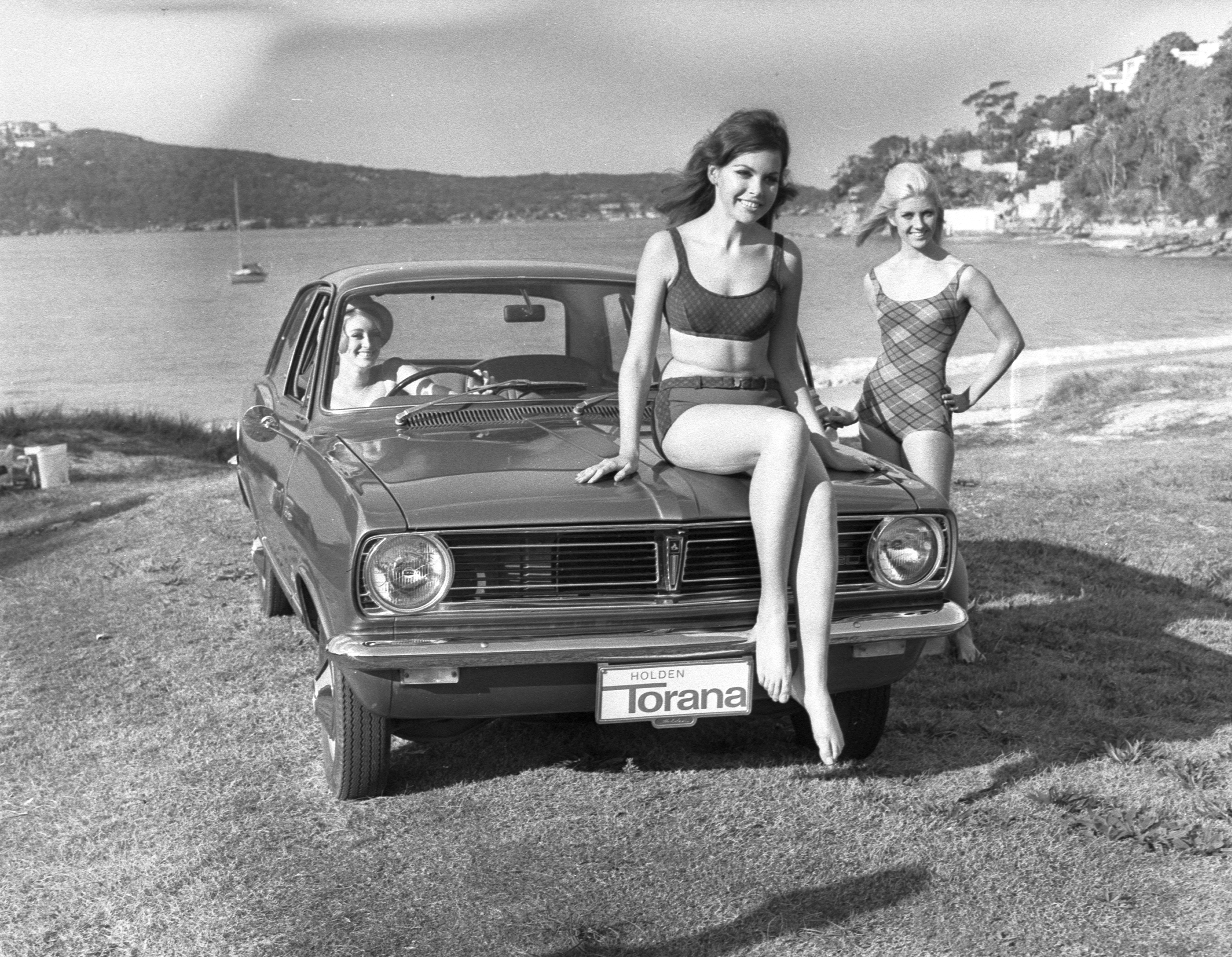 Jantzen women's swimsuits for 1967 modelled at Chinamans Beach alongside the latest-model Holden Torana