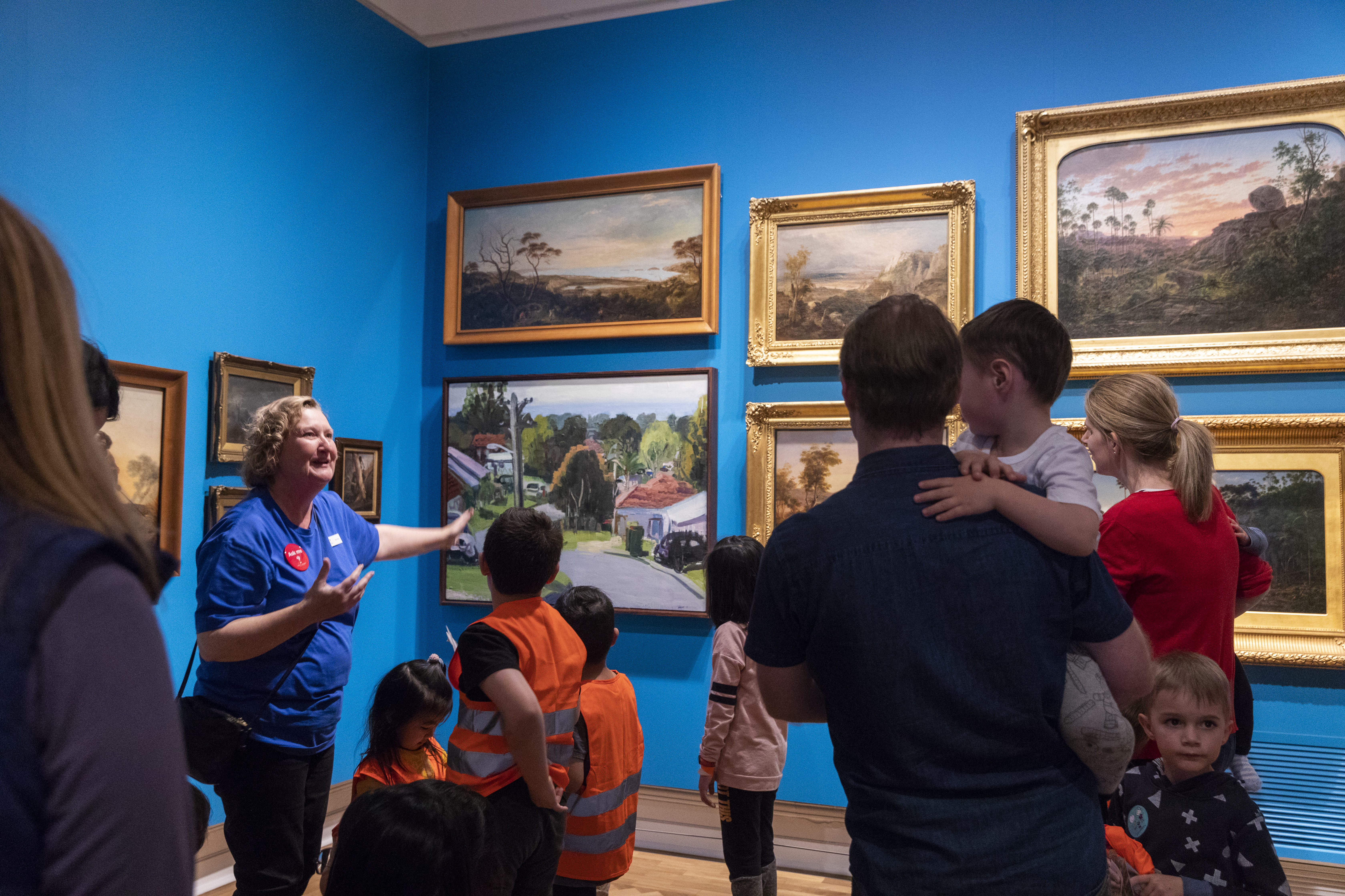 Children and parents on a tour of the paintings gallery