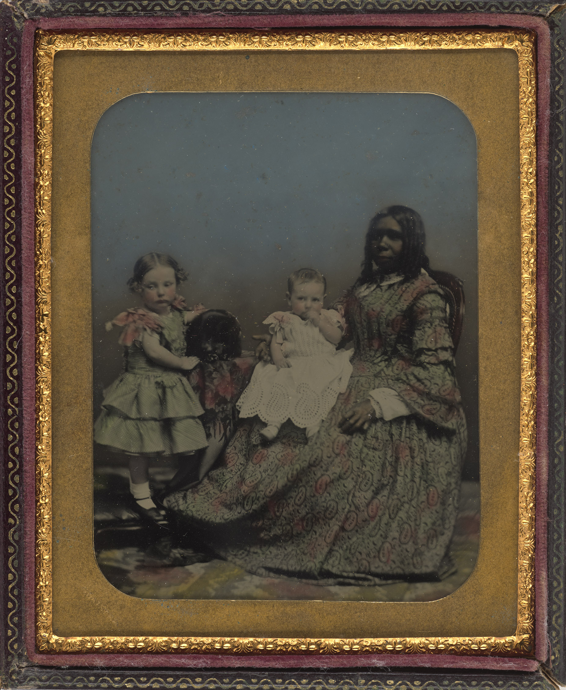 Ambrotype portrait with two young children and a woman
