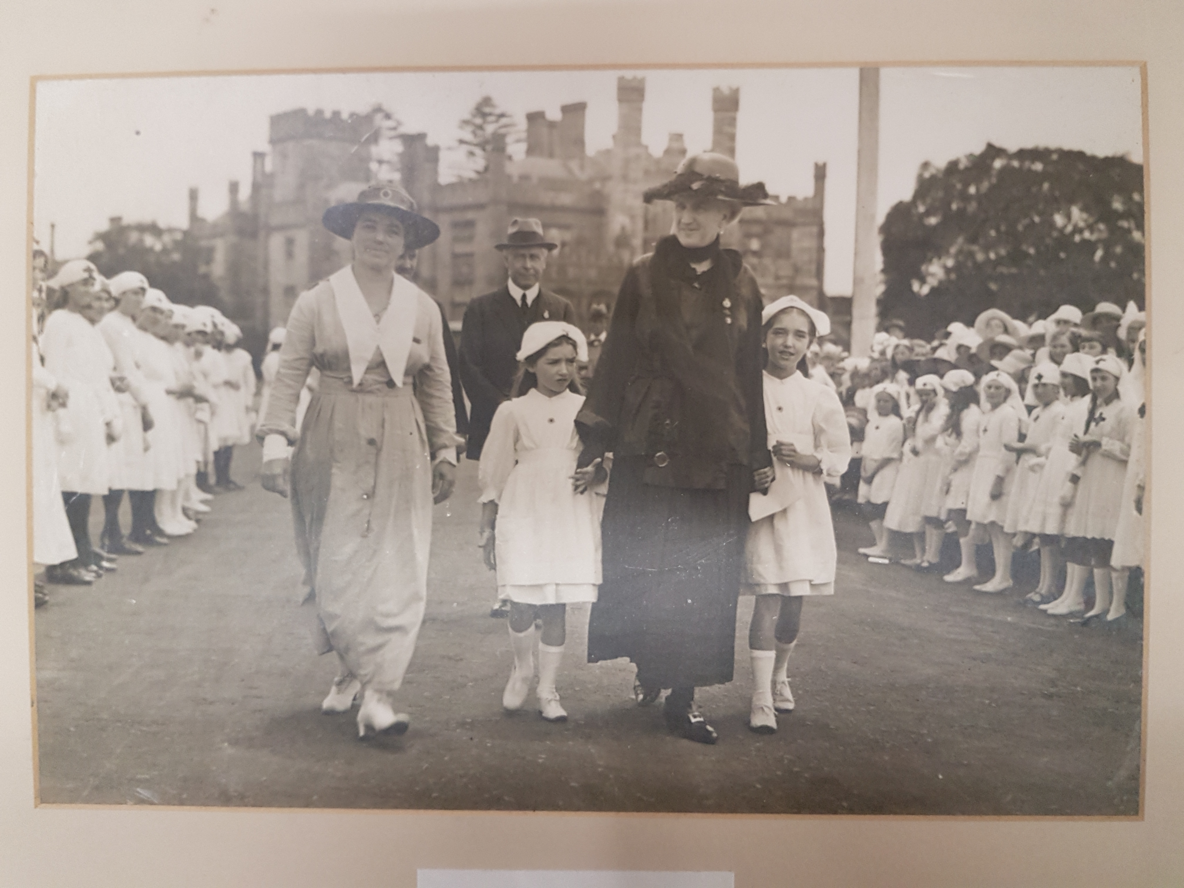 Eleanor MacKinnon (left) and Lady Strickland (right) accompanied by two female members of the Junior Red Cross at Government House, Sydney.