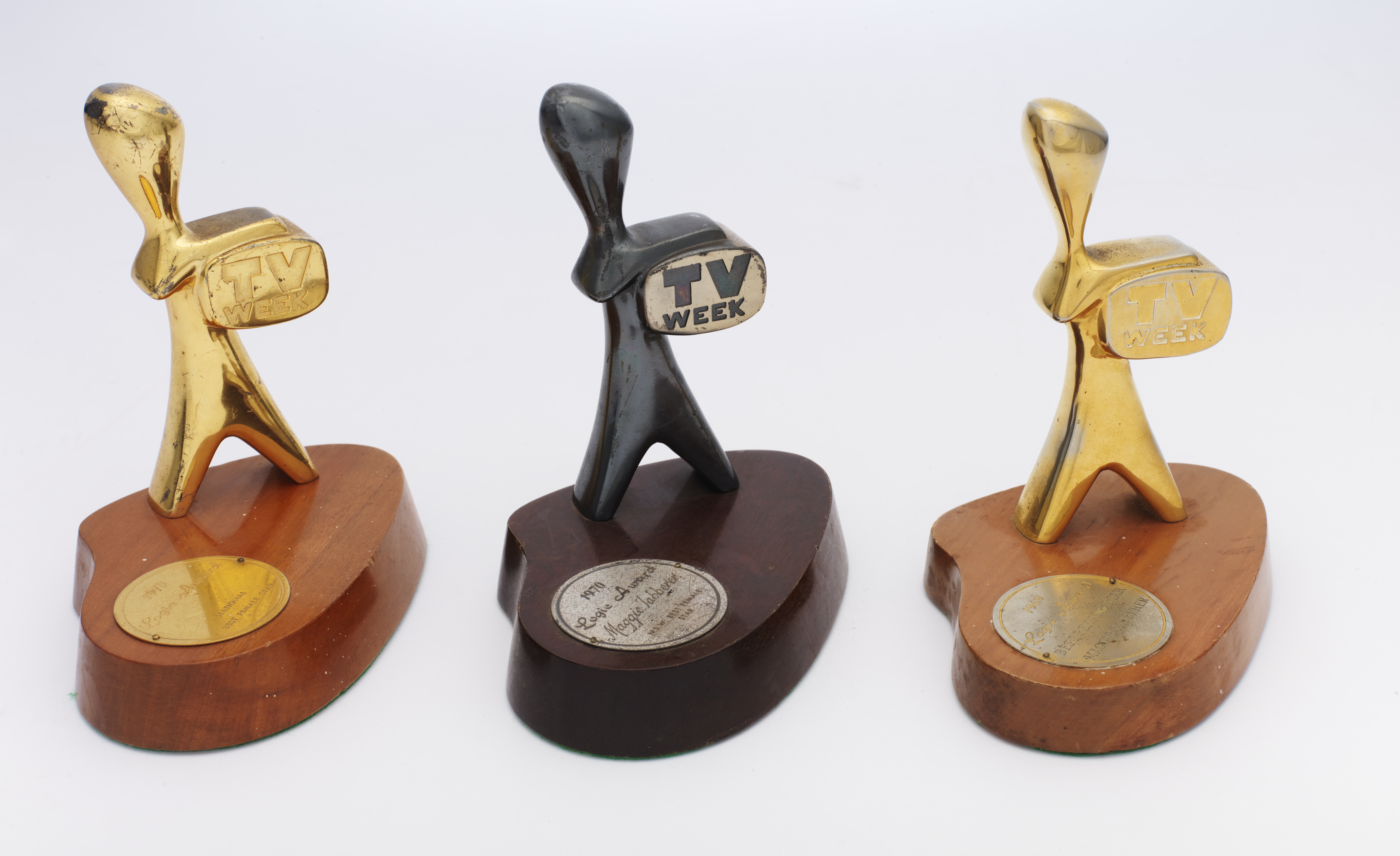 Three logie award trophies