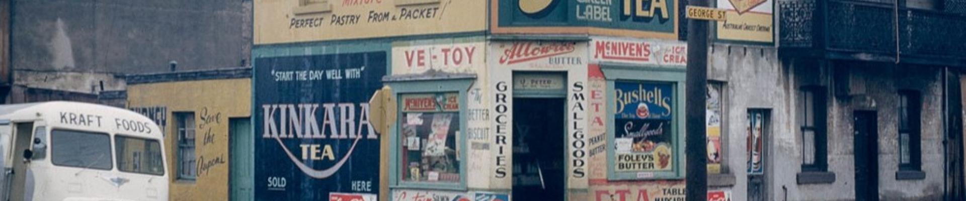 ‘U. Peters corner store, George Street, Waterloo’ by Australian Photographic Agency, c 1956-1960.⁣