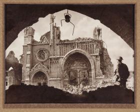 Soldier standing in the rubble of a destroyed church
