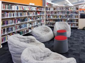 Internal view of library with beanbag seats and bookshelves