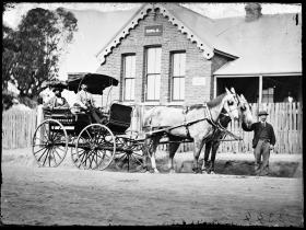 B.O. Holtermann in his carriage and pair outside the girls' section of the Hill End Public School