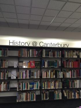 Library bookshelves with sign - History @ Canterbury