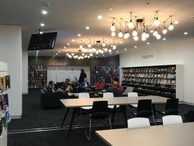 Tables, chairs and bookshelves in a library