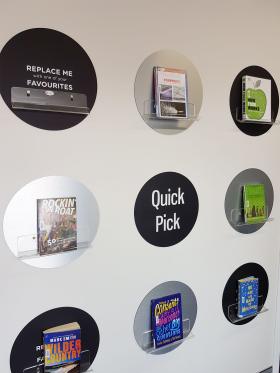 Books displayed on a library wall in a grid