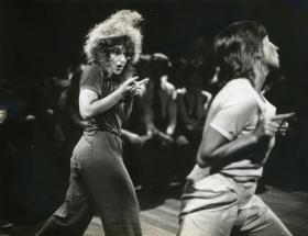 Black and white photograph of two women on stage.