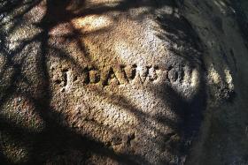 rock carved with the name "J Dawson"