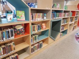 Children's area in library, bookshelves with built in seating