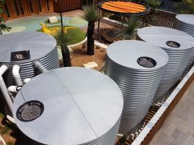 Outdoor area with corrugated iron water tanks