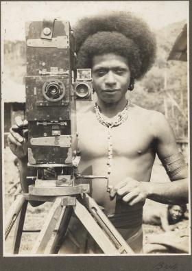 Bioto (man with camera), Papua New Guinea, 1921–23, by Frank Hurley