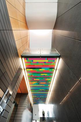 Internal stairs with a multicoloured glass ceiling