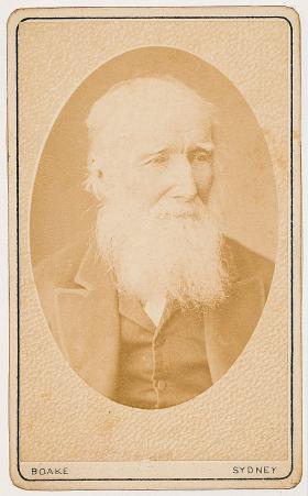 An old, sepia portrait of a white, bearded man.