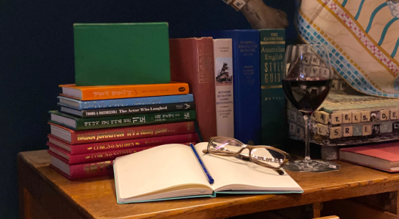 Books on table with wine