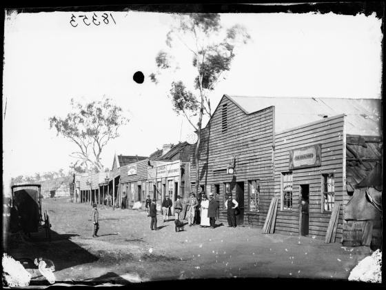 Mayne Street, Gulgong, looking east from Colonial Wines, C. Giugni jeweller, Prince of Wales Theatre, S.Green's Hairdressing Salon and Dillon's Hotel