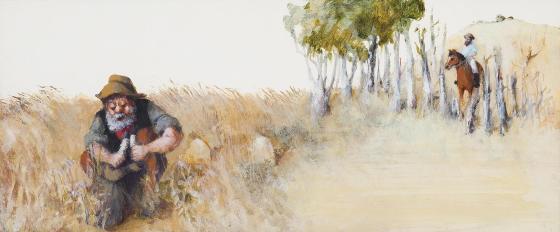 A man crouches in the midst of tall grass.