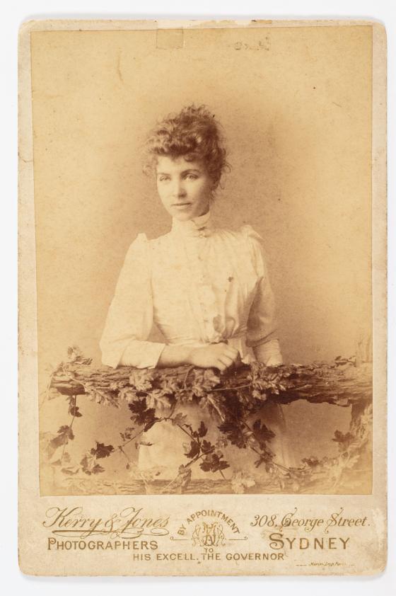 Sepia photograph of a woman in a white dress
