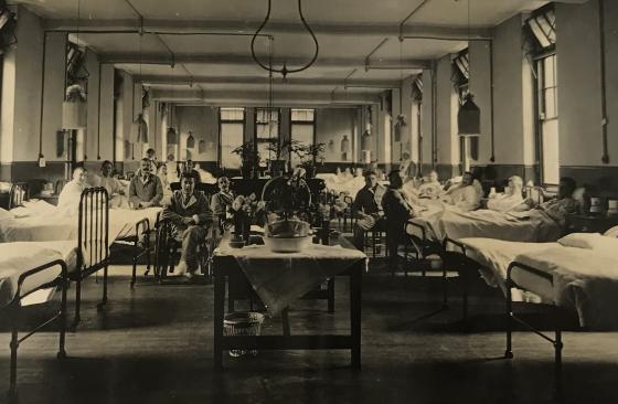 Christmas Day, 1916, showing patients in beds and wheelchairs at ward 6, North Evington military hospital, Leicester.