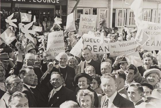 Crowd welcomes the Dean of Canterbury, Hewlett Johnson, at Sydney Airport