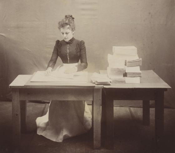 Photo of a bookbinder, or sewer, in the NSW Government Printing Office, taken some time between 1871 and 1910