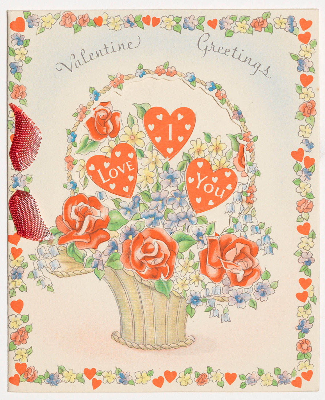 Cover of a Valentine's Day card, featuring a bouquet of hearts with "I love you" on it.