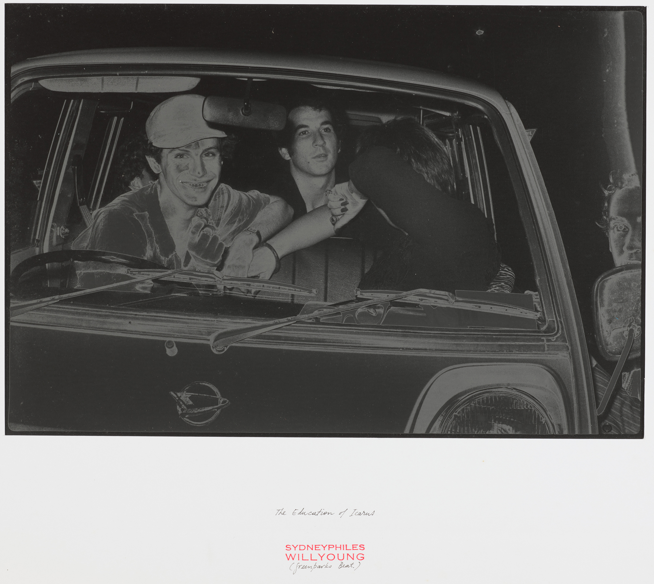 Black and white solarised print of three people in a car.