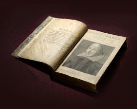 Shakespeare First Folio open on title page featuring a picture of William Shakespeare